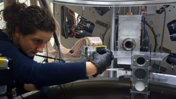 Preparations for the experiment with stretched nuclear states at the Cyclotron Centre Bronowice IFJ PAN in Kraków. Circular carbon disks can be seen on the right. Pictured: Sara Ziliani (University of Milan), one of the co-authors. (Source: IFJ PAN)