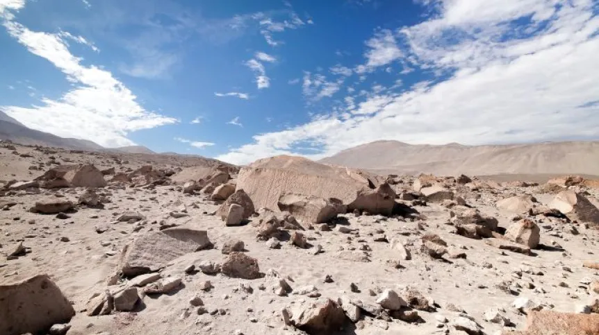 Boulder TM 1219 in a wider landscape perspective. Credit: A. Rozwadowski, source: Cambridge Archaeological Journal.